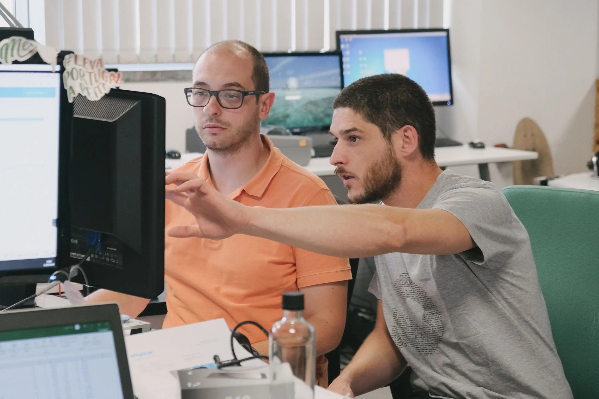 Group of young people working together and focusing on solving programming problems at Premium Minds' office