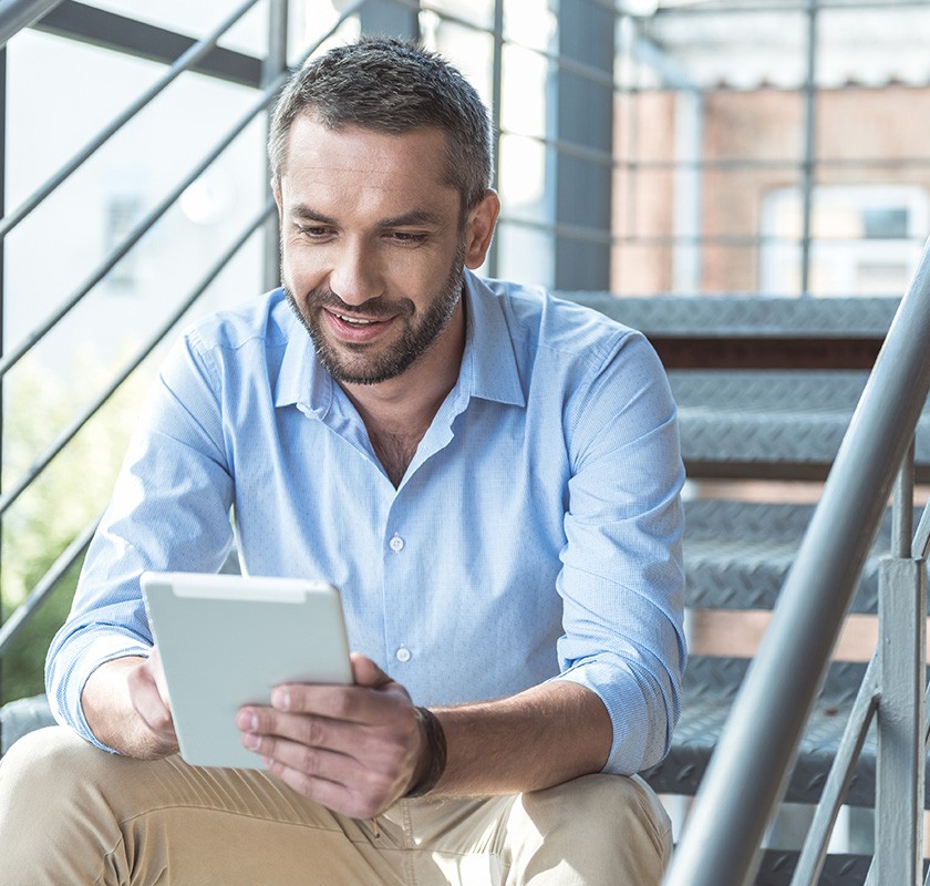 A young man using the Concensum app on a tablet